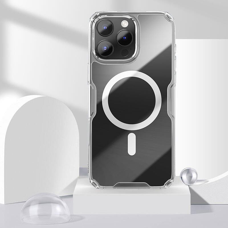 A Clear Magnetic iPhone 16 Pro Max Case, shockproof and crystal-clear, is shown on a white, geometric surface. The phone case features a circular design on the back that indicates its MagSafe compatible wireless charging capabilities.