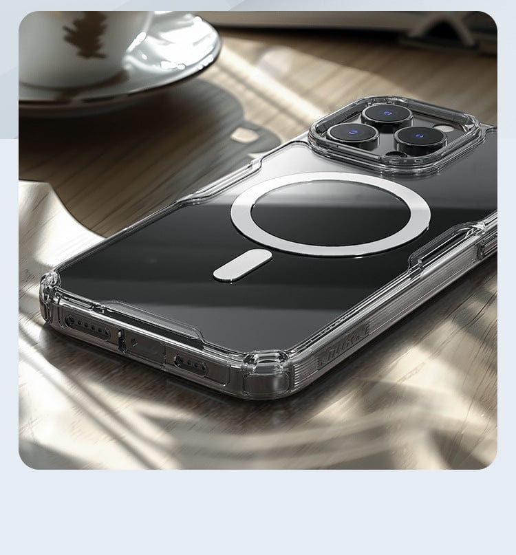 A Clear Magnetic iPhone 16 Pro Max Case with a crystal-clear design featuring shockproof protection and MagSafe compatibility is placed on a wooden surface.