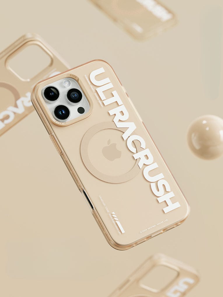 A beige iPhone 16 Pro Max with an UltraSleek clear case featuring the text "ULTRACRUSH" repeated on a beige background, offering shockproof 5-layer protection and magnetic wireless charging capabilities.