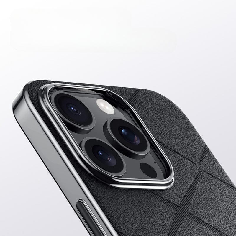 Close-up of an iPhone 16 Pro Max with three rear cameras, featuring a premium leather case in a geometric patterned black design, showcasing camera protection and shockproof durability with a metal button finish.