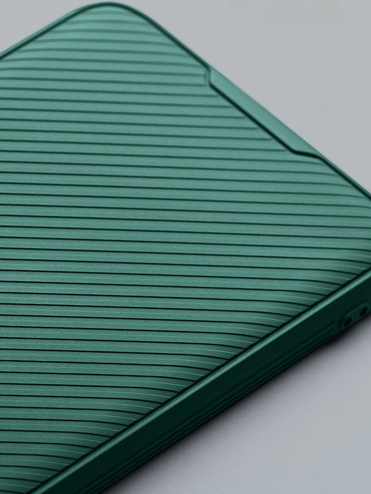 Green iPhone 16 Pro Max case with vertical ridges, partially open against a gray background, offering dual-layer shockproof protection and an anti-slip grip.
