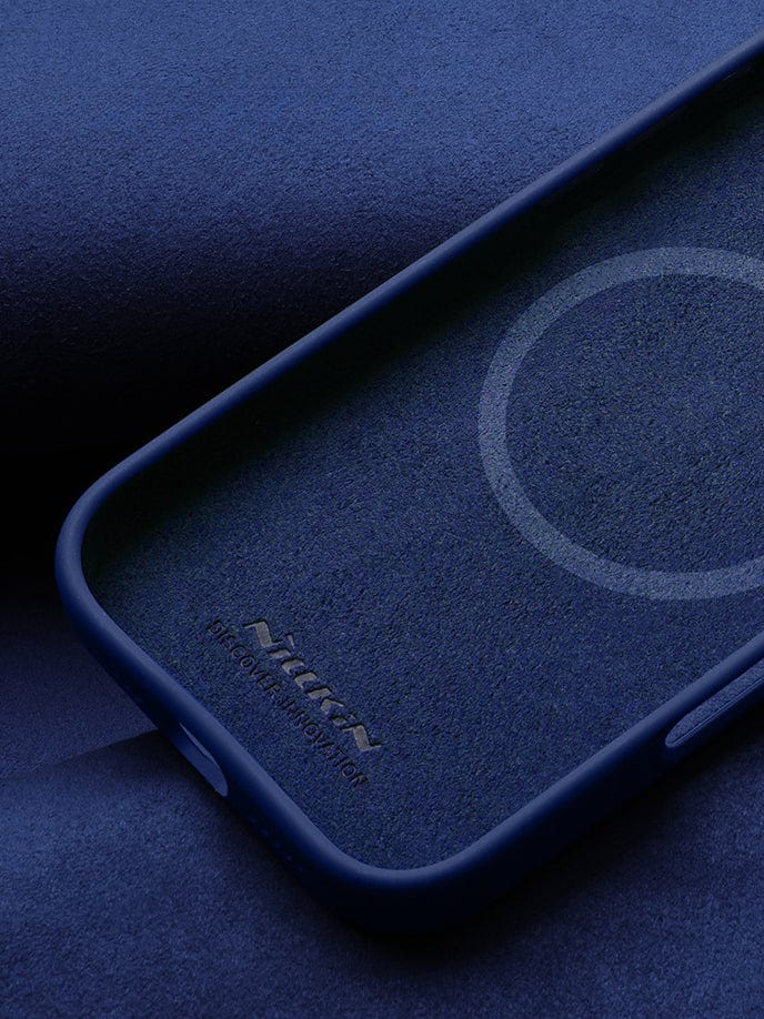A MagSafe-Compatible iPhone 16 Pro Max case with silicone grip and an aluminum camera kickstand, featuring a circular indentation design on the inside, lying on a blue surface.