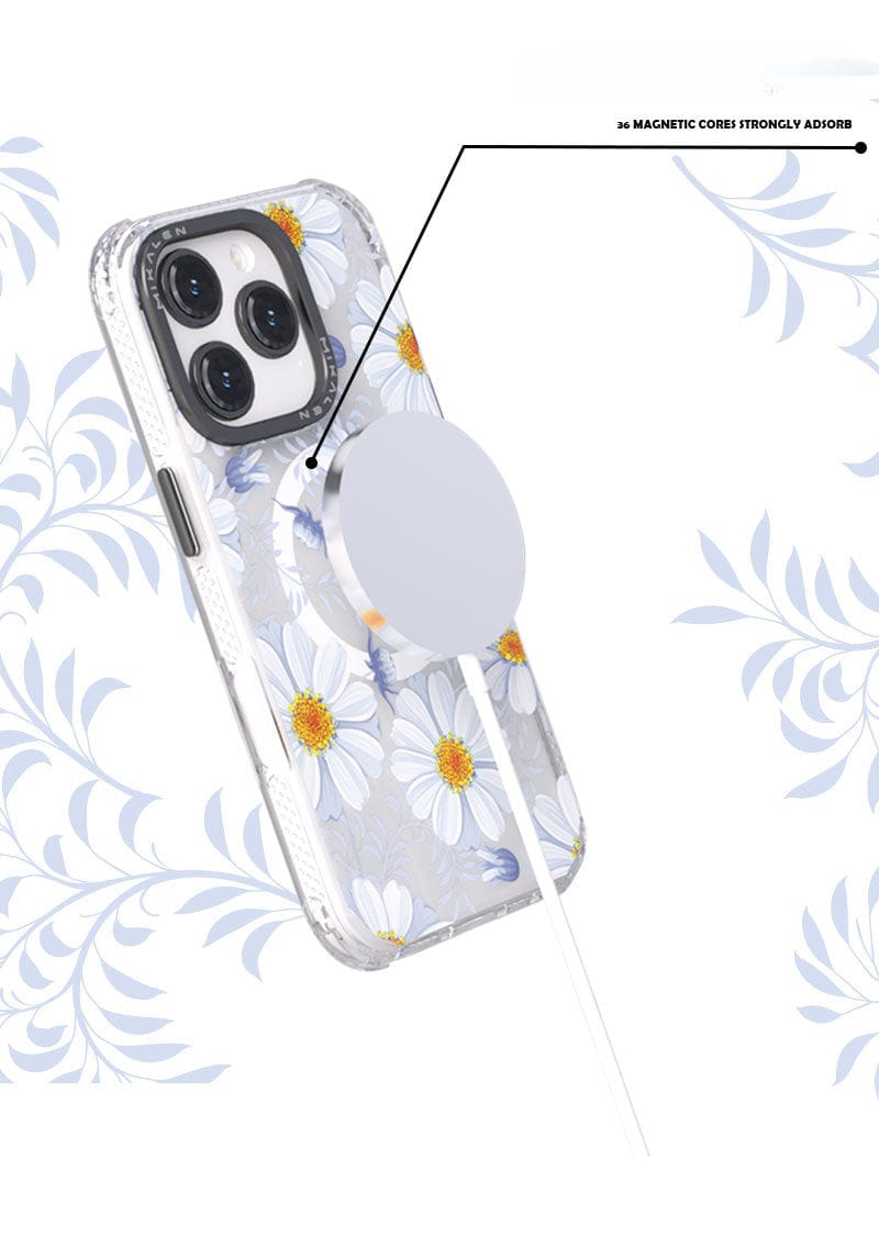 A smartphone with a Floral MagSafe iPhone 16 Pro Max Case, showcasing a shockproof clear cover with a 3D flower design, is attached to a magnetic wireless charger. Text reads "MAGNETIC CORE STRONGLY ADHERES.