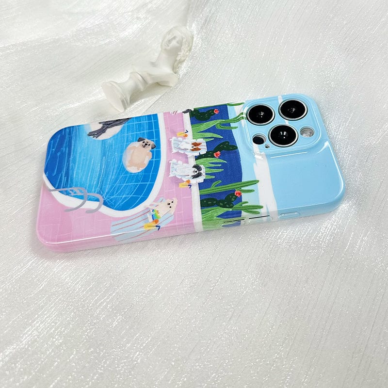 The iPhone 16 Pro Max Case with Relaxing Poolside Dogs - Cute and Protective features a colorful poolside scene with dogs; some are swimming in the pool while others are lounging on the deck, surrounded by potted plants and a cactus. The case is displayed on a shiny white surface, accompanied by a small white statue.