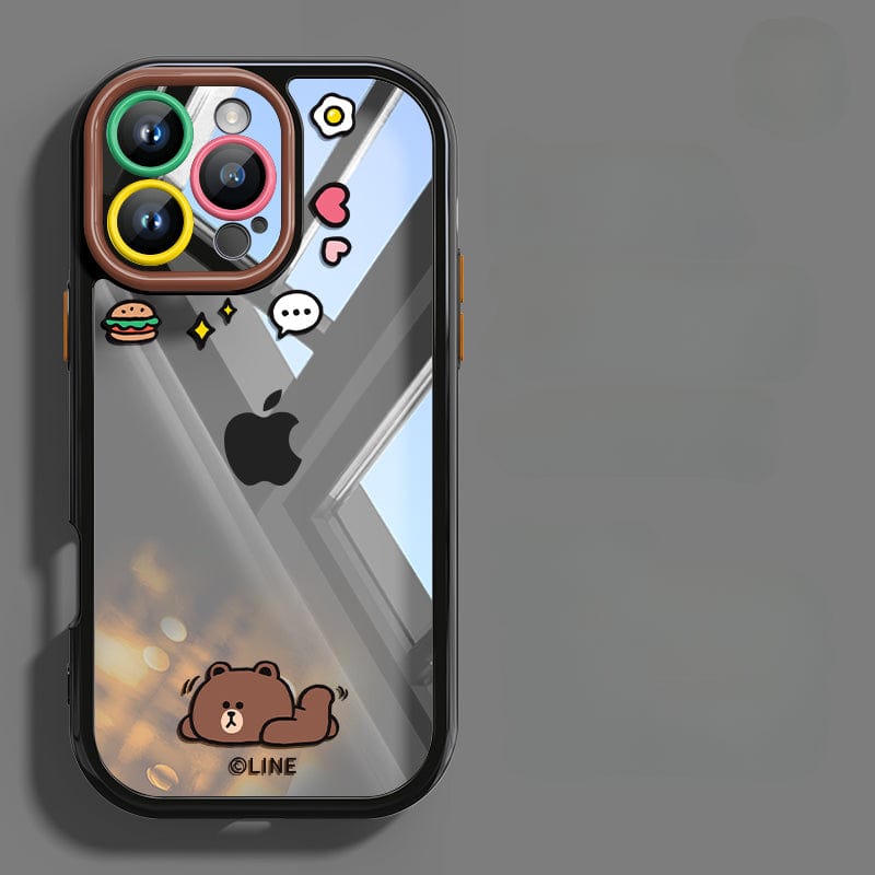 This iPhone 16 Pro Max Case - Cute Cartoon Clear Protective Cover with Shockproof Bumper and Anti-Yellowing Transparent Back in Black features a clear back showcasing a cartoon brown bear, a speech bubble, and decorative icons around the camera cutout. The Apple logo remains visible through the shockproof protection, offering both style and anti-scratch lens protection.