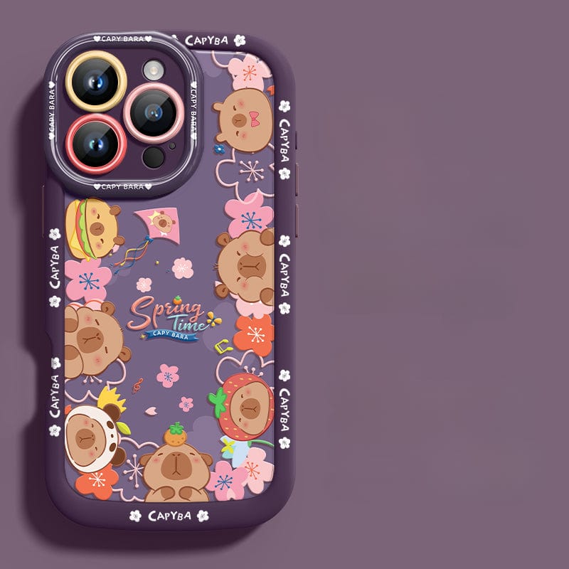 An iPhone 16 Pro Max Cute Bear Silicone Case showcasing playful cartoon bear heads with various accessories. This case features a predominantly dark design accented with floral elements and the "Spring Time" text at its center. It offers not just style but also shockproof protection due to its soft touch liquid silicone construction, ensuring durability and anti-scratch properties.