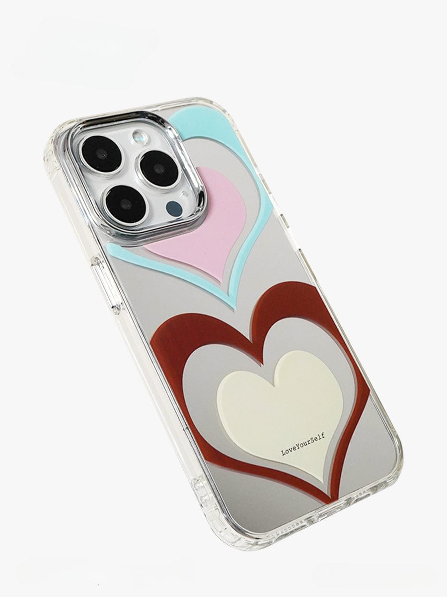 The Retro Heart Layers iPhone 16 Pro Max Case offers an all-inclusive protective cover with a vibrant "Love Yourself" design featuring a clear back adorned with a pattern of three nested hearts in blue, pink, brown, and white. The text "Love Yourself" is elegantly displayed on the largest heart.