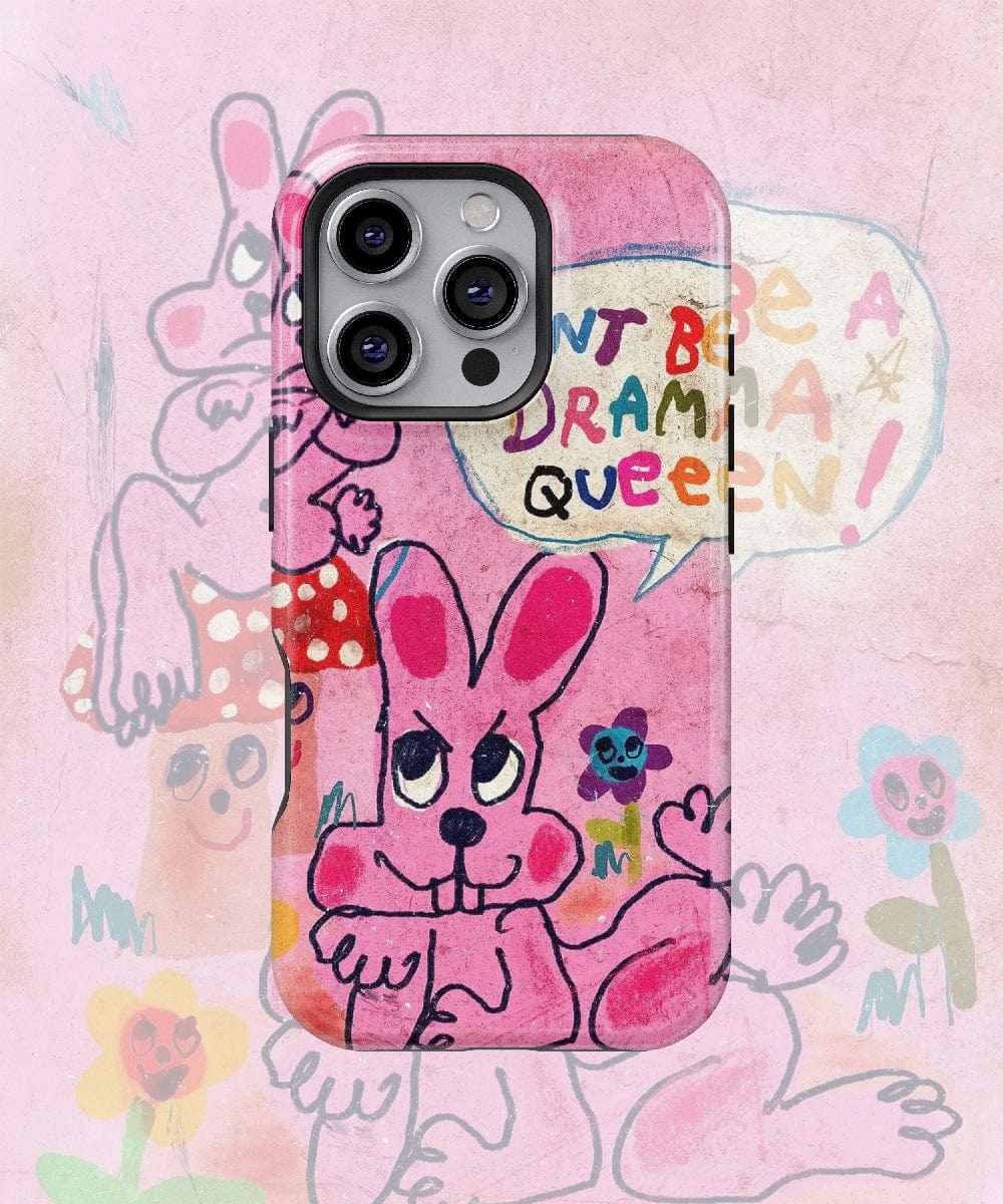 Introducing our Pink Bunny "Don’t Be a Drama Queen" iPhone 16 Pro Max Case – Quirky Cartoon Design, Bold Colors, Fun Aesthetic. This case features a pink cartoon rabbit with a speech bubble that says, "Don't be a drama queen!" The background is adorned with abstract, colorful illustrations of various characters and flowers. Plus, it offers shockproof protection to keep your phone safe.