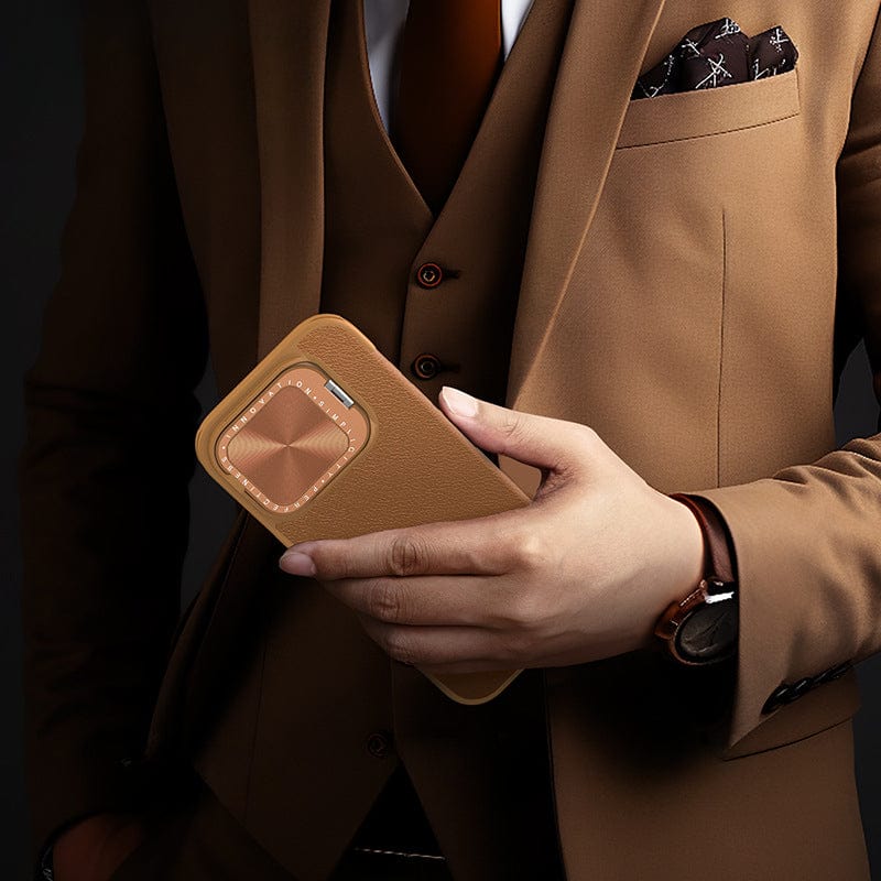 A person in a brown suit holding an iPhone 16 Pro Max Leather Flip Case with Card Holder, designed for full protection and featuring a premium leather exterior, with a matching pocket square and wristwatch.