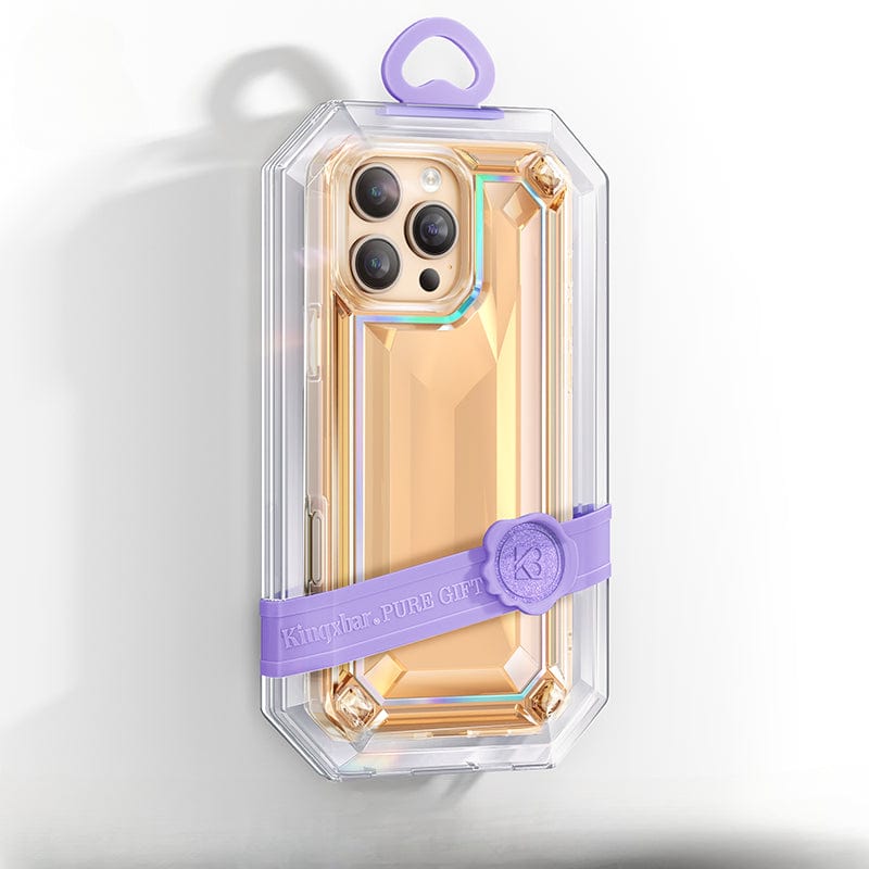 A gold smartphone encased in a shockproof, clear, faceted iPhone 16 Pro Max case with purple accents and a "Kingyba: PURE GIFT" strap, featuring 360° all-around protection and crafted from anti-yellowing material.