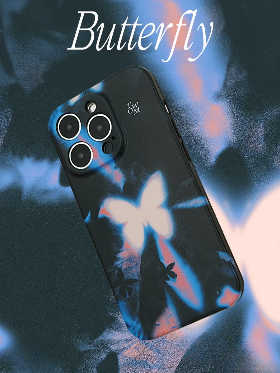 A Luminous Butterfly iPhone 16 Pro Max Case, featuring the Mystical Glow Design, is displayed on a surface adorned with similar butterfly-themed patterns. The text "Butterfly" is prominently featured at the top of the image.