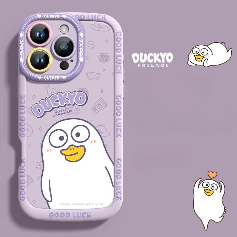 Introducing the iPhone 16 Pro Max Yellow Duck Cartoon Case – a cute and stylish protective cover made from durable, soft liquid silicone. This shockproof, anti-yellowing case features a vibrant design with a purple background adorned with small fruit and heart illustrations. It showcases a charming yellow duck along with the text "DUCKYO" and "GOOD LUCK," while additional cartoon duck images decorate the sides for added flair. Slim fit ensures both style and protection for your device.