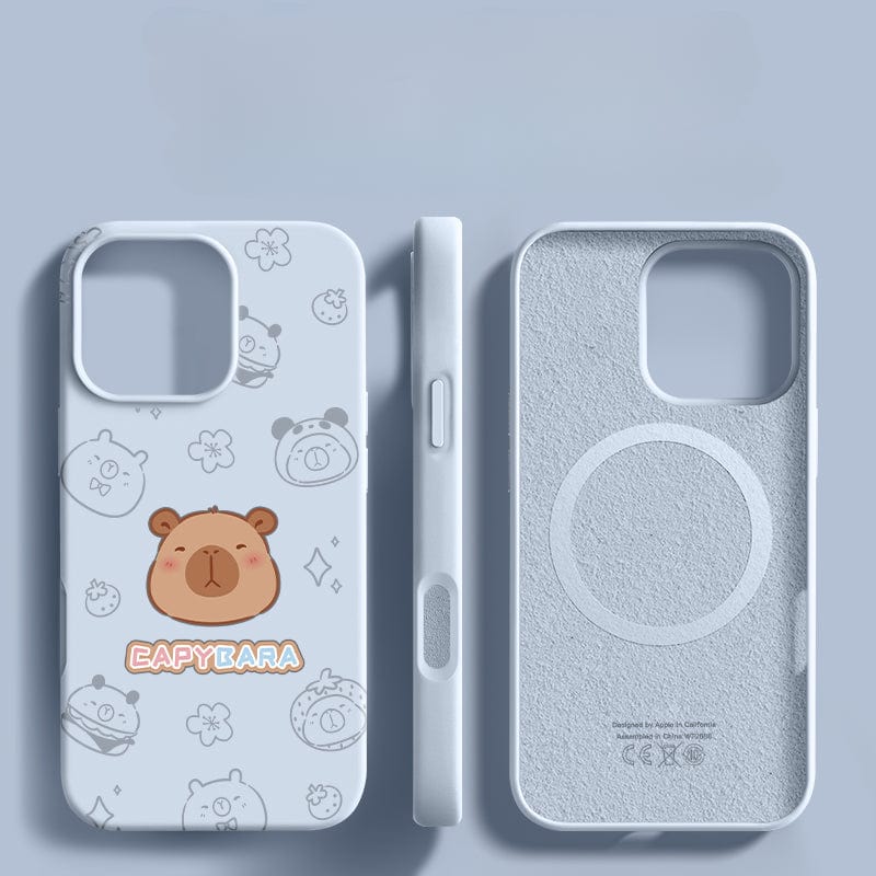 Three iPhone 16 Pro Max cases with adorable capybara cartoon designs and "CAPYBARA" text are displayed on a light blue surface, featuring a triple-layer shockproof structure and anti-fingerprint coating for comprehensive protection.