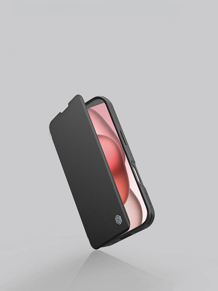 A smartphone, likely an iPhone 16 Pro Max, is partially covered by the iPhone 16 Pro Max Leather Flip Case with Card Holder featuring a premium leather exterior. Against a plain gray background, the phone's screen showcasing a red and pink gradient is partially visible.