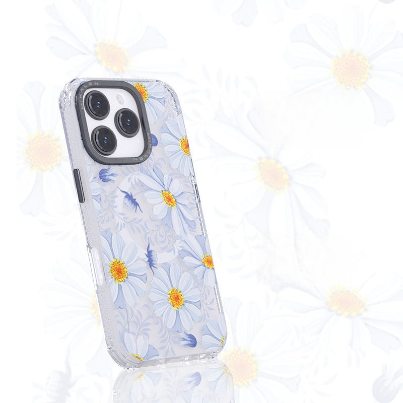 The Floral MagSafe iPhone 16 Pro Max Case, a shockproof clear cover featuring a 3D flower design with white and yellow daisy patterns, is standing upright against a matching floral background.