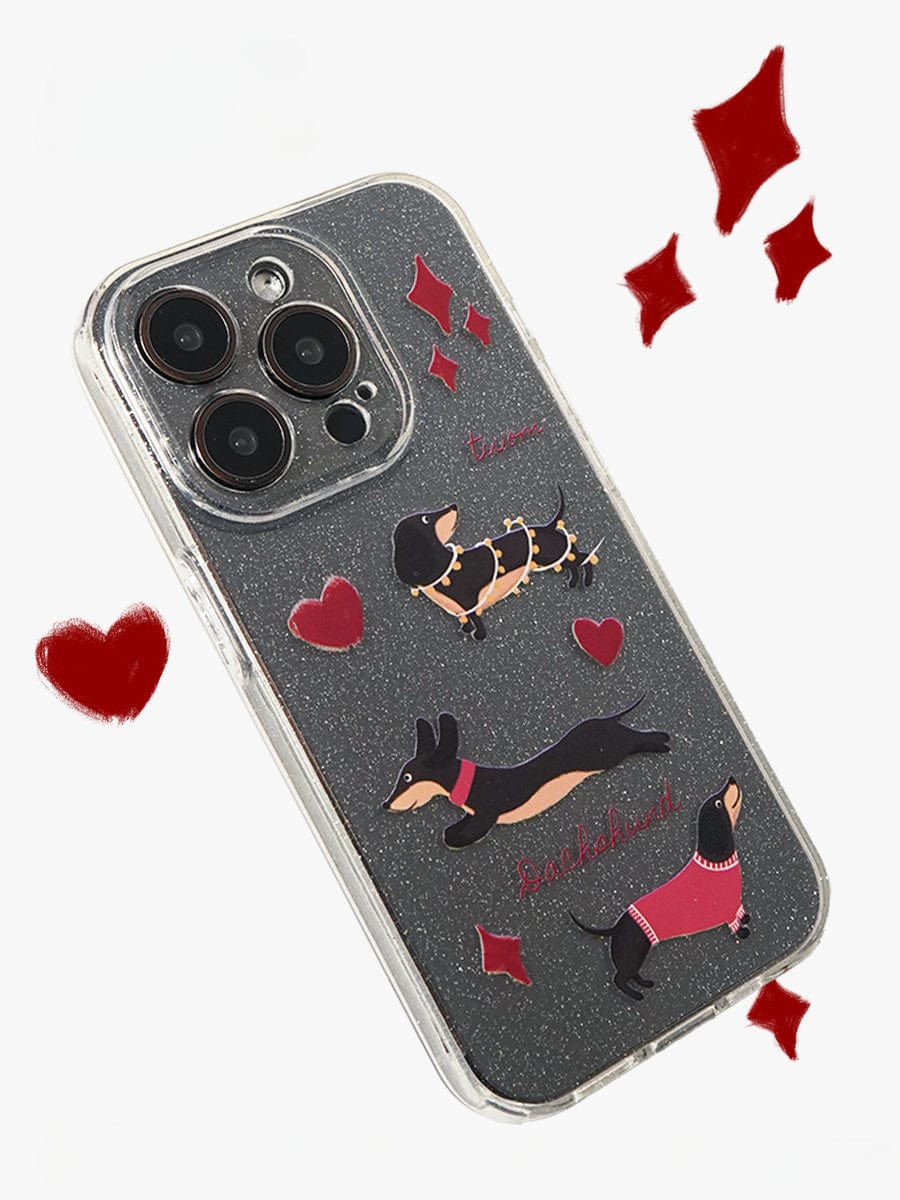 The "Dachshund Love iPhone 16 Pro Max Case" is a clear, sparkling design adorned with illustrations of four dachshunds in various poses, accented by red hearts and diamonds. It features the words "I love you" and "Dachshund" written in vibrant red, with scattered hearts completing the charming look. This cute all-inclusive protective cover adds both style and protection to your device.