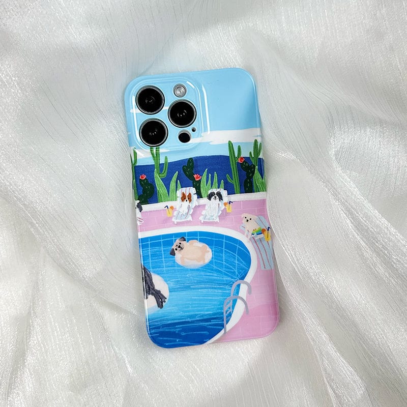 This iPhone 16 Pro Max Case with Relaxing Poolside Dogs - Cute and Protective, features a whimsical scene of dogs lounging by a pool. Some of the dogs are seated poolside, while others float on pool rings. The backdrop showcases cacti and a clear blue sky filled with fluffy clouds, all set against a light pink surface.