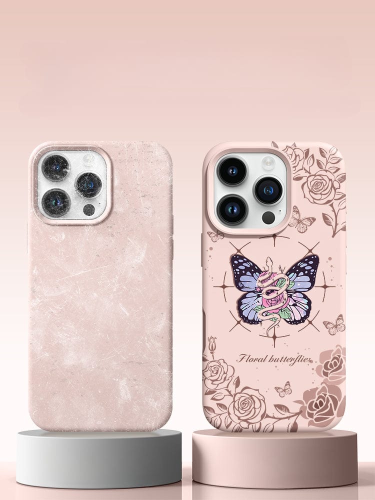 Two smartphones on pedestals; the left phone features an iPhone 16 Pro Max case with a plain pink marble design, while the right phone is fitted with an iPhone 16 Pro Max Floral Butterfly Case, made from premium liquid silicone and offering shockproof protection, anti-yellowing properties, and a soft touch.