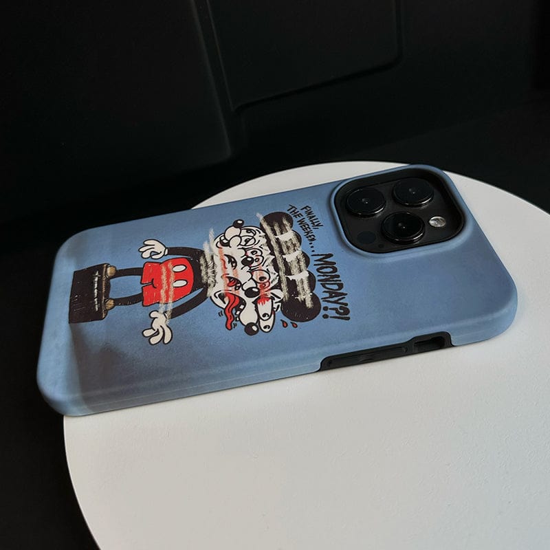 A Distorted Cartoon Monday Blues iPhone 16 Pro Max Case, featuring a blue hard shell, is placed on a white circular stand. The case showcases a cartoon character with multiple eyes and the text "Monday?" while the camera lenses of the phone are prominent, occupying part of the top-right corner of the case.