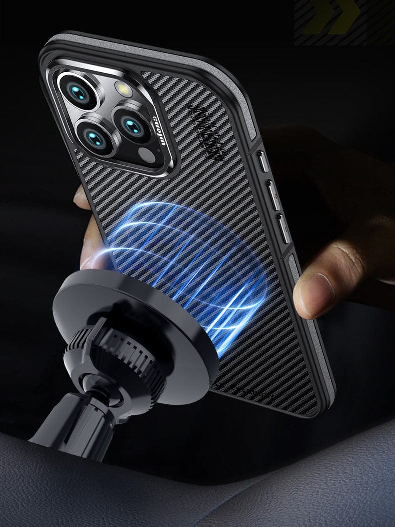 A person holding an iPhone 16 Pro Max adorned with an N52 Magnetic MagSafe Case, designed with black textured 600D Aramid Fiber, standing near a magnetic phone holder illuminated by blue lighting effects.