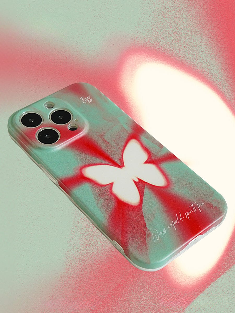 A close-up of the Butterfly Aura iPhone 16 Pro Max Case, showcasing a butterfly design in vibrant red, white, and blue shades. The case features the text "Wing a wonderful purifying pin" and includes room for three camera lenses.