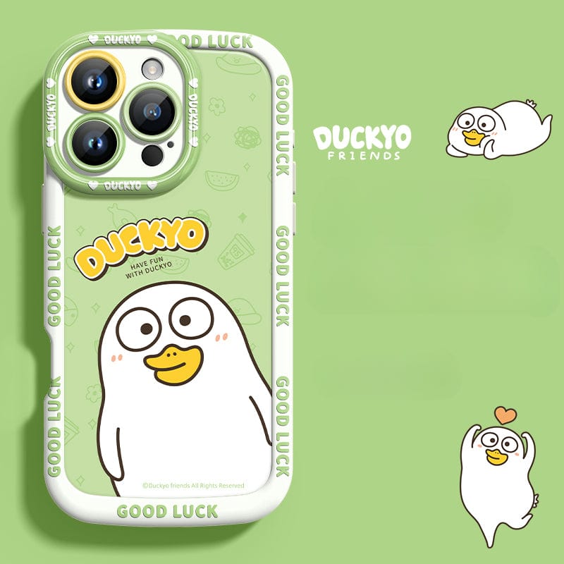 The green iPhone 16 Pro Max Yellow Duck Cartoon Case features the adorable "Duckyo" character along with text saying "GOOD LUCK" and "HAVE FUN WITH DUCKYO" spread across various spots. The background is adorned with additional Duckyo illustrations. Enjoy a blend of style and shockproof protection with this cute yellow duck design, made from soft liquid silicone that is both anti-yellowing and slim-fit.