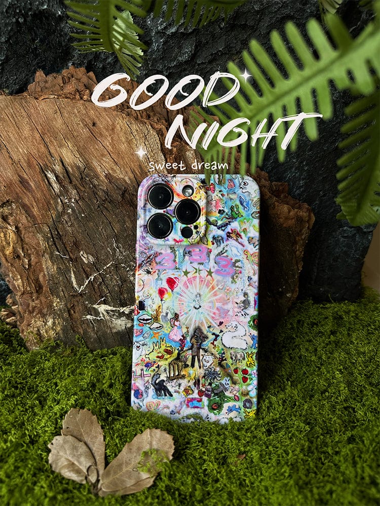 The Whimsical Dreamscape iPhone 16 Pro Max Case - Fantasy-Inspired Artistic Design, adorned with various whimsical illustrations, stands upright on a bed of vibrant green moss, surrounded by tree bark and fern leaves. The text "GOOD NIGHT" and "sweet dream" is written above the phone in white font.