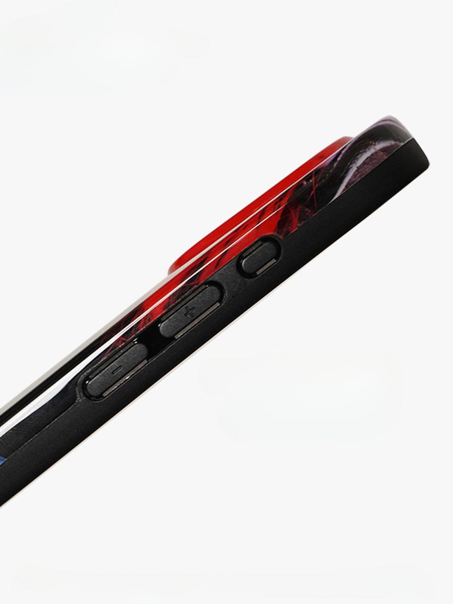 Side view of the Bold Rockstar iPhone 16 Pro Max Case in a vibrant pop art red and black design. The focus is on the three side buttons, including volume control and a possible power button, all integrated seamlessly into the all-inclusive protective cover. The background is plain white.