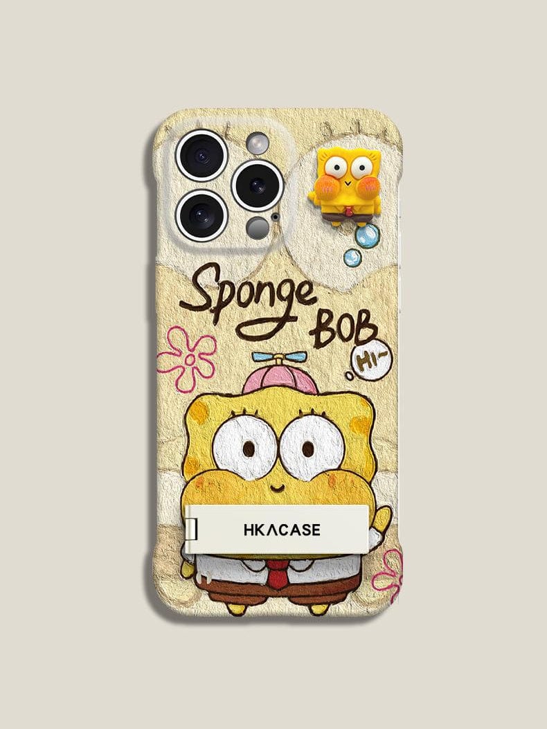 An ultra-thin frameless iPhone 16 Pro Max case featuring a SpongeBob SquarePants cartoon design with "SpongeBob" text, a small attached figure of the character, "HKACASE" written on a label at the bottom, and includes a foldable stand in pink and yellow.