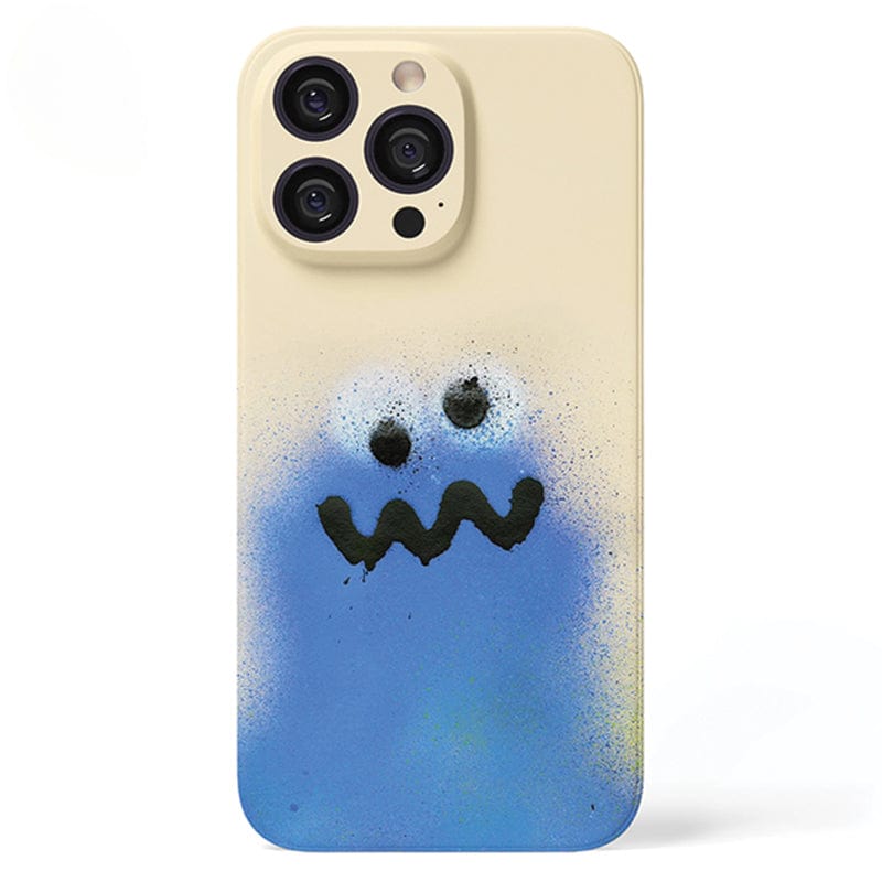 A Colorful Spray Art iPhone 16 Pro Max Case Set in beige, featuring a vibrant graffiti design of a playful blue ghost with large eyes and a wavy mouth.