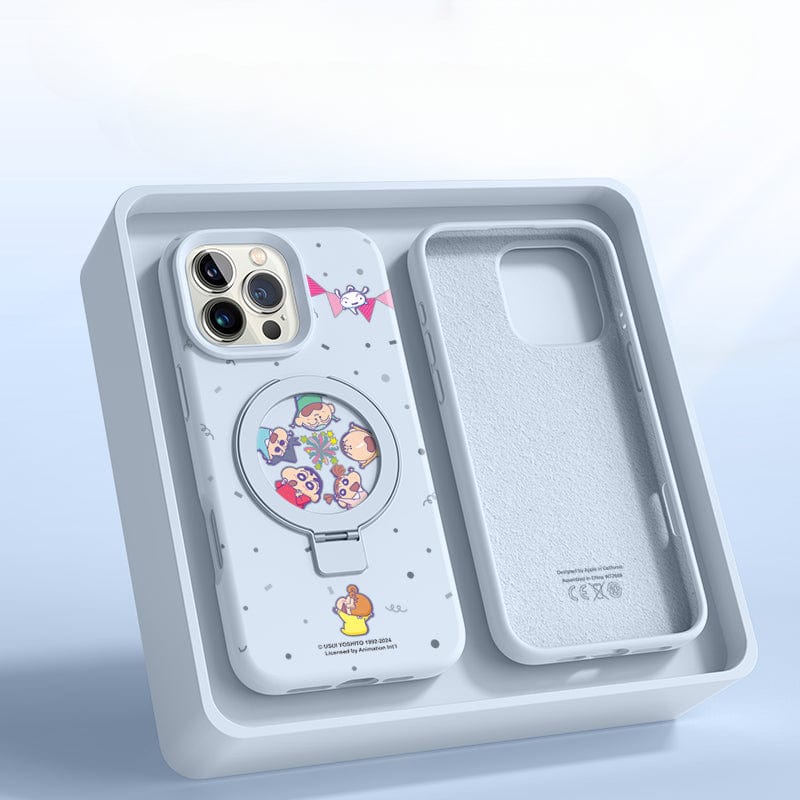 An iPhone 16 Pro Max with a light gray and cartoon-themed MagSafe case is displayed in open packaging. The liquid silicone shockproof protective cover includes an empty compartment beside it, along with a ring stand feature.