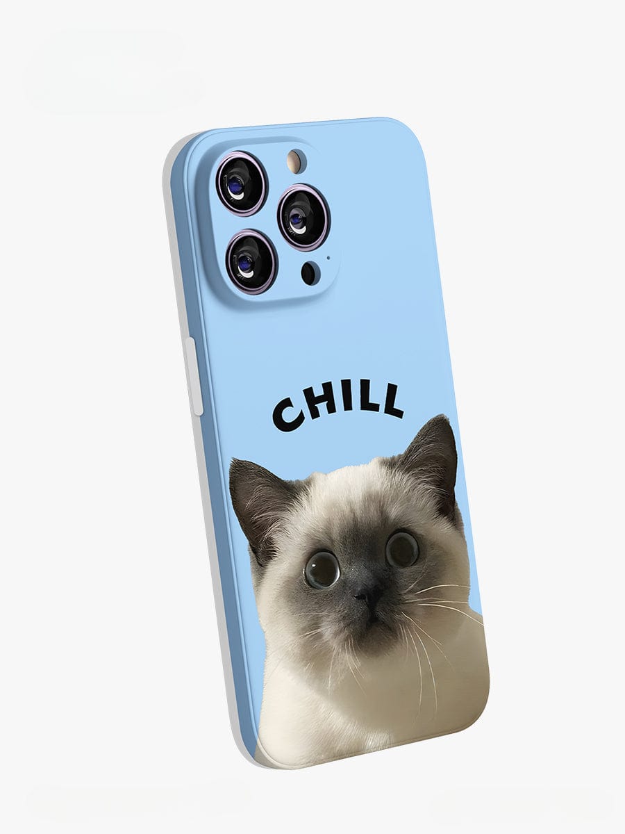 The Chill Cat iPhone 16 Pro Max Case features a curious-looking white and gray cat with large eyes on a light blue background. The word "CHILL" is printed above the cat in black. This cute, all-inclusive protective cover is designed to fit an iPhone 16 Pro Max with three rear camera lenses.