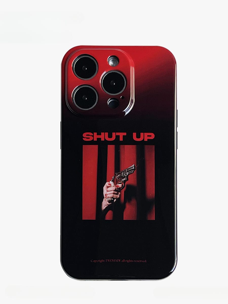 Introducing the Shut Up Red Gradient iPhone 16 Pro Max Case, an all-inclusive protective cover that features a bold statement design. The case boasts a striking red and black color scheme with "SHUT UP" in bold capitals above an image of a hand holding a gun, all set against vertical red curtains.