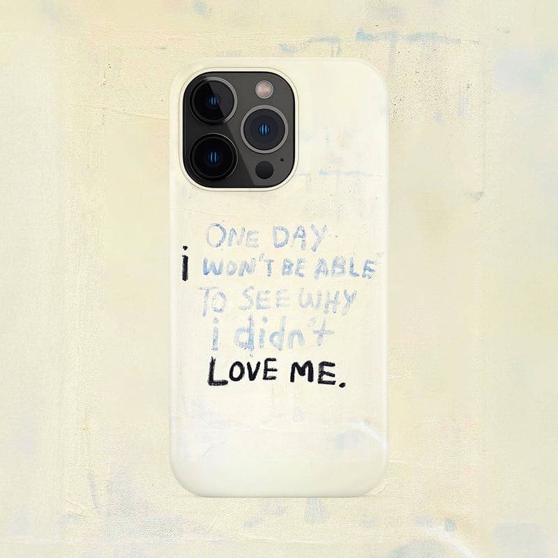 A smartphone with a Minimalist Inspirational Quote iPhone 16 Pro Max Case. The case, in white, features the text "ONE DAY I WON'T BE ABLE TO SEE WHY I didn't LOVE ME," promoting empowerment and self-love. The phone is set against a light, textured background.