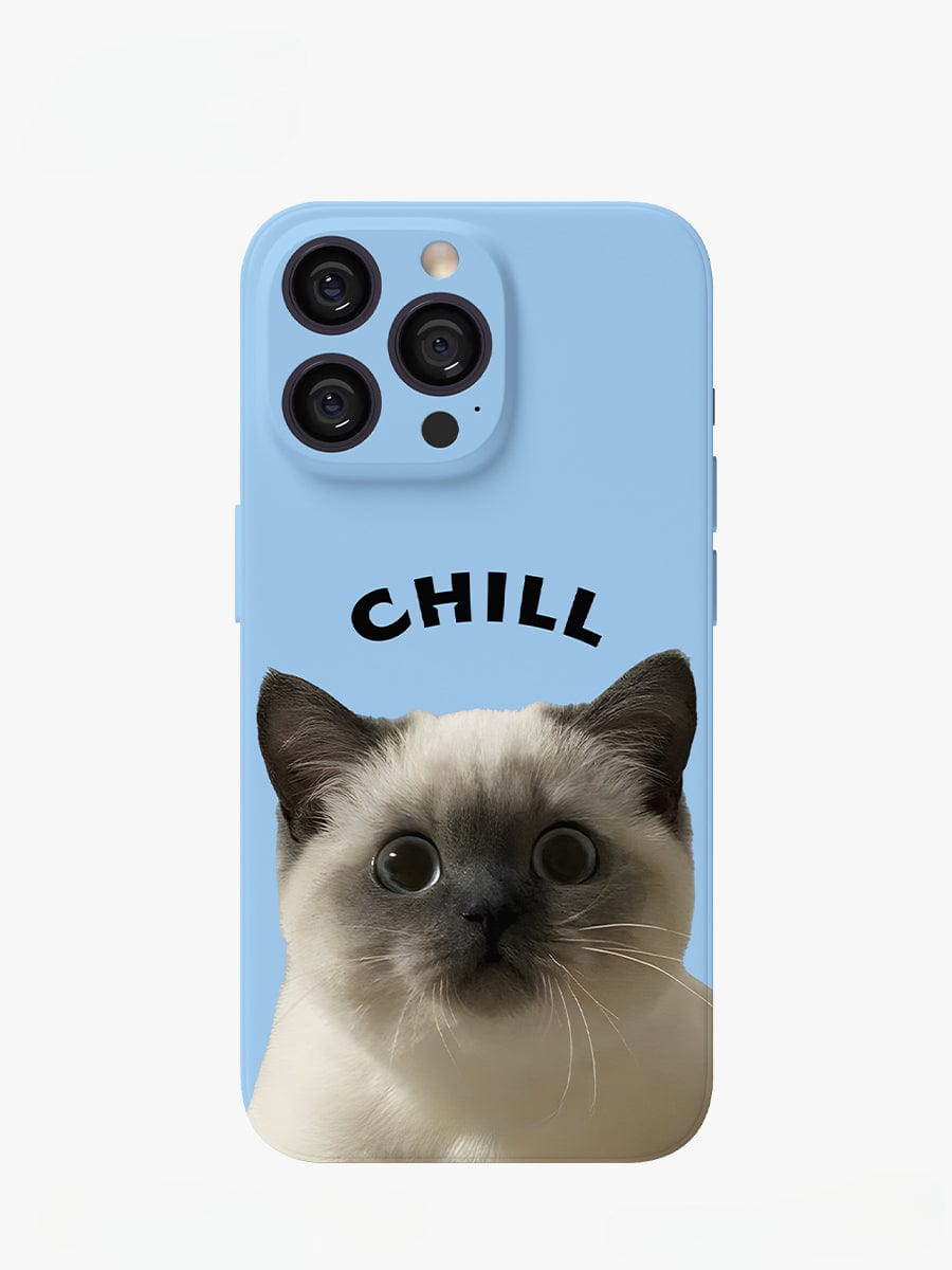 The Chill Cat iPhone 16 Pro Max Case features a cute, light blue background with the word "CHILL" written in black, arched letters above an adorable kitten's face with light fur and darker ears. The wide-eyed cat has a surprised or inquisitive expression, adding a playful touch. This adorable all-inclusive protective cover is designed specifically for iPhone 16 Pro Max.