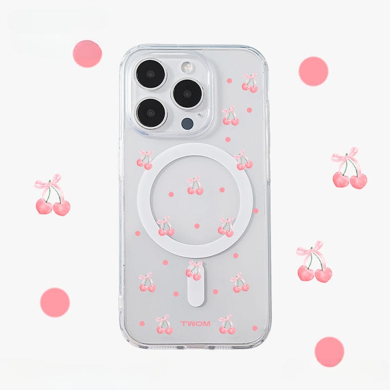 The Cherry Blossom MagSafe iPhone 16 Pro Max Case, featuring a cute 3D cherry design and an all-inclusive protective cover, is clear with a circular MagSafe outline and a TWOM logo at the bottom. It is adorned with small pink cherries and dots, as well as larger pink cherries and dots scattered throughout the background.