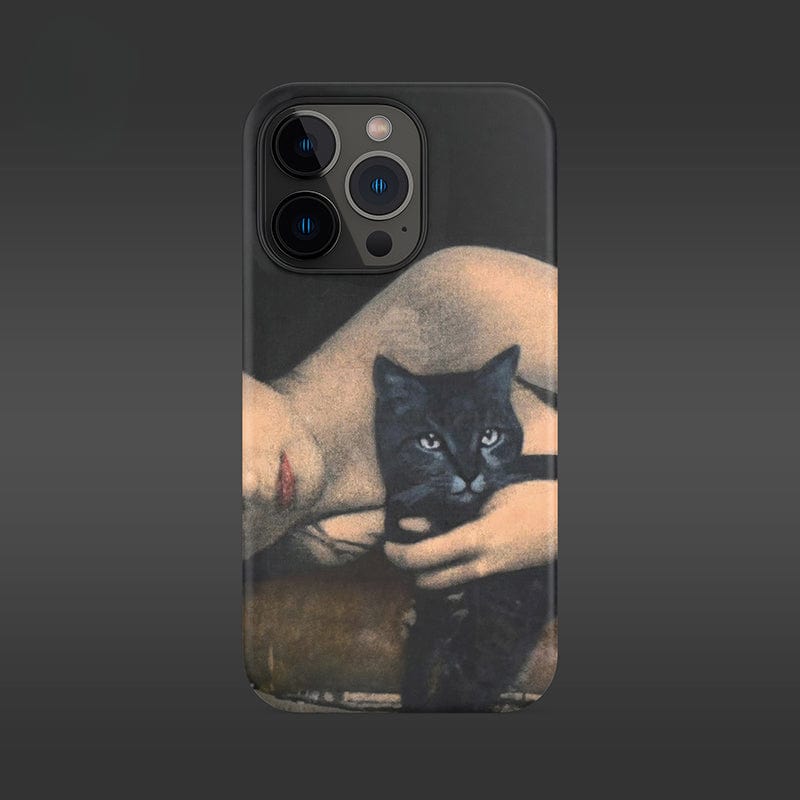 Introducing the Artistic Portrait iPhone 16 Pro Max Case - Vintage Black Cat and Woman Design. This ultra-slim case offers full protection and showcases a bespoke design featuring a woman reclining while holding a black cat. The woman's face is partially visible, with the cat staring directly at the camera. The dark gray gradient background adds an elegant touch to this unique artwork.