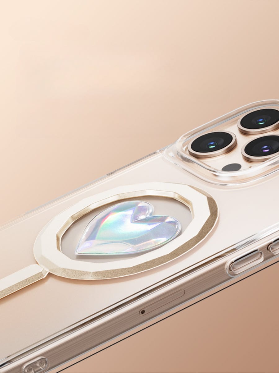 The iPhone 16 Pro Max Clear Case features a metallic accent with a holographic heart design on the back and offers MagSafe compatibility for effortless magnetic absorption.