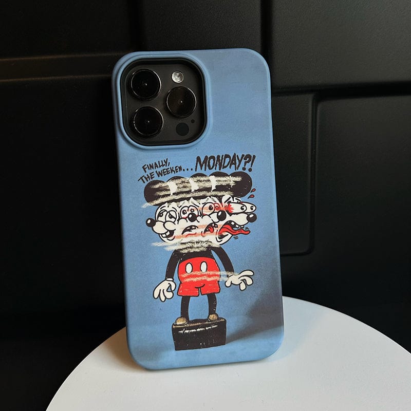 A smartphone encased in the Distorted Cartoon Monday Blues iPhone 16 Pro Max Case - Bold and Protective, featuring a cartoon character with exaggerated facial expressions, red pants, and black shoes, standing on a pedestal. The text above reads, "Finally, the weekend... MONDAY?!" against a blurry blue gradient background.