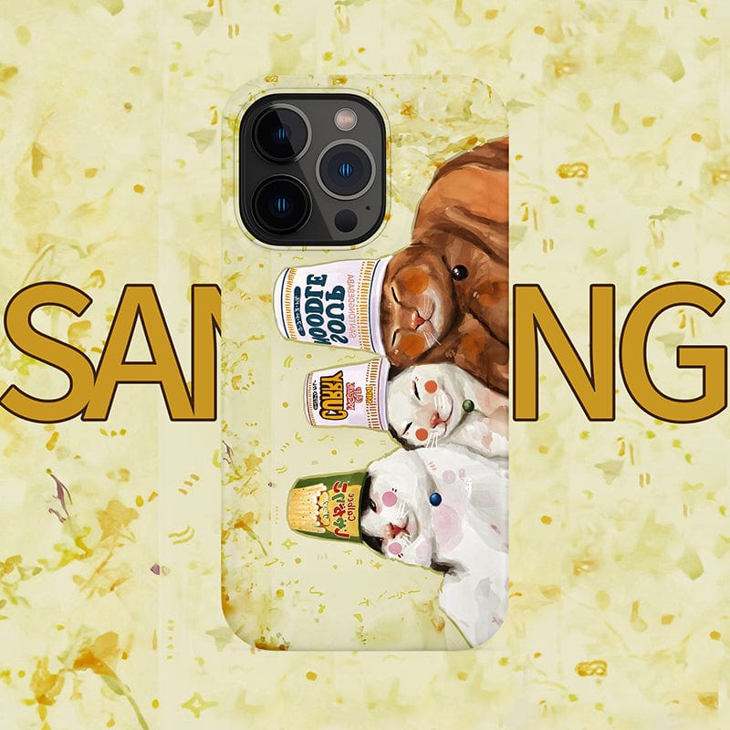 A smartphone case for iPhone 16 Pro Max featuring an illustration of adorable cats and cup noodles. The cats are playfully positioned with some holding food containers. The background has a yellow confetti-like pattern with the word "SAMIUNG" partially visible.