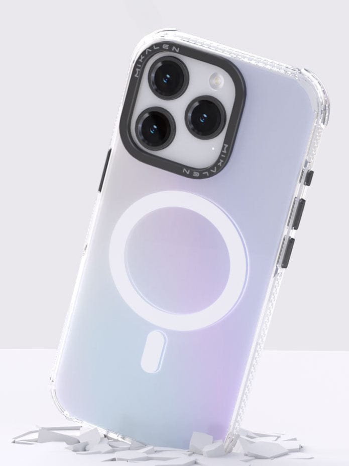 An iPhone 16 Pro Max encased in a translucent purple MagSafe case that features a circular design on the back and raised lens protection, photographed against a solid purple background.