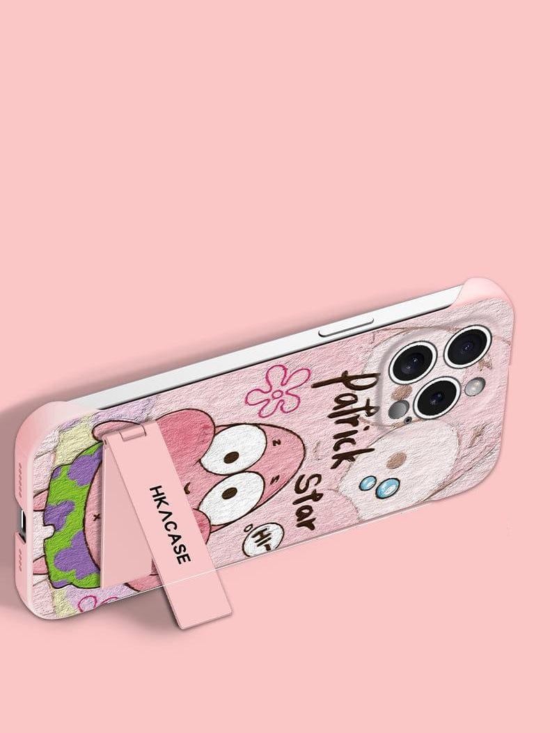 The iPhone 16 Pro Max Ultra-Thin Frameless Case features a cartoon character design with a pink and yellow color scheme. It includes a hand strap labeled "HKCASE" set against a pink background and an integrated foldable stand for added convenience.