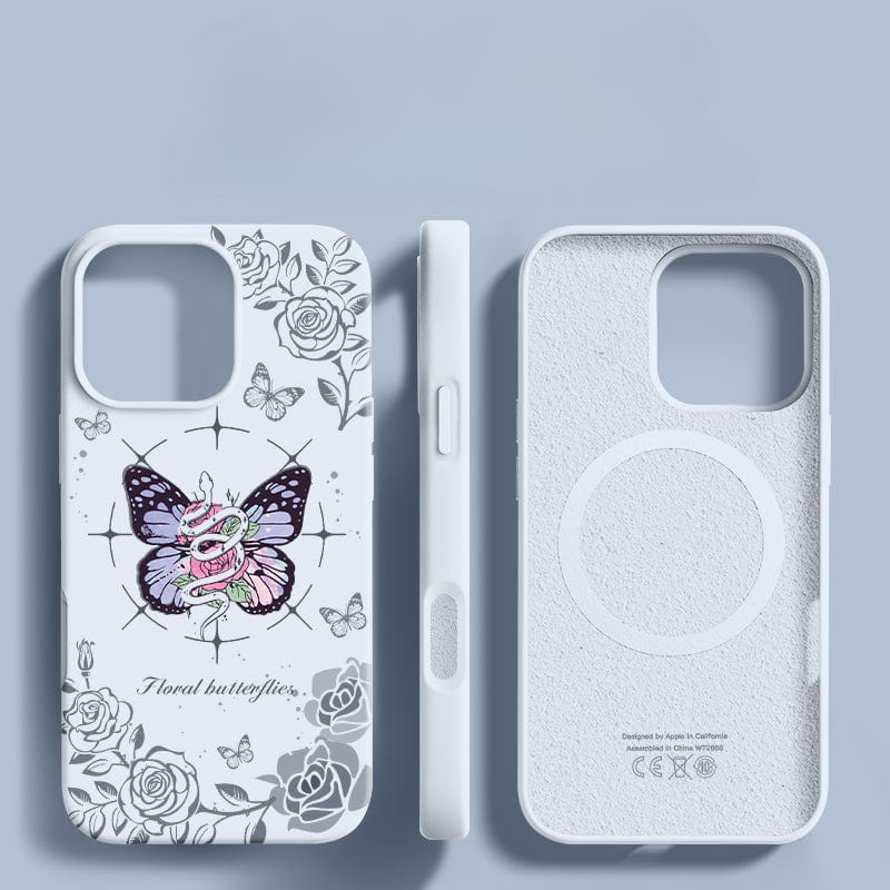 Three perspectives of the iPhone 16 Pro Max Floral Butterfly Case - Liquid Silicone, Shockproof, Anti-Yellowing, Soft Touch are displayed. One view reveals the front with its floral and butterfly design, another highlights the side with buttons, and the final one showcases the inside featuring a MagSafe ring. This liquid silicone case offers triple-layer shockproof protection for enhanced durability.