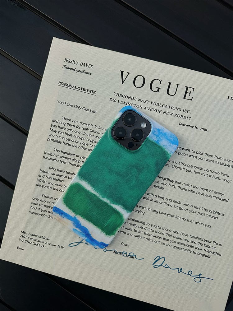 A smartphone with an Abstract Color Block iPhone 16 Pro Max Case, featuring a modern art-inspired, minimalist design with full protection, is placed on top of a printed Vogue article featuring Jessica Daves. The background appears to be a dark, flat surface.