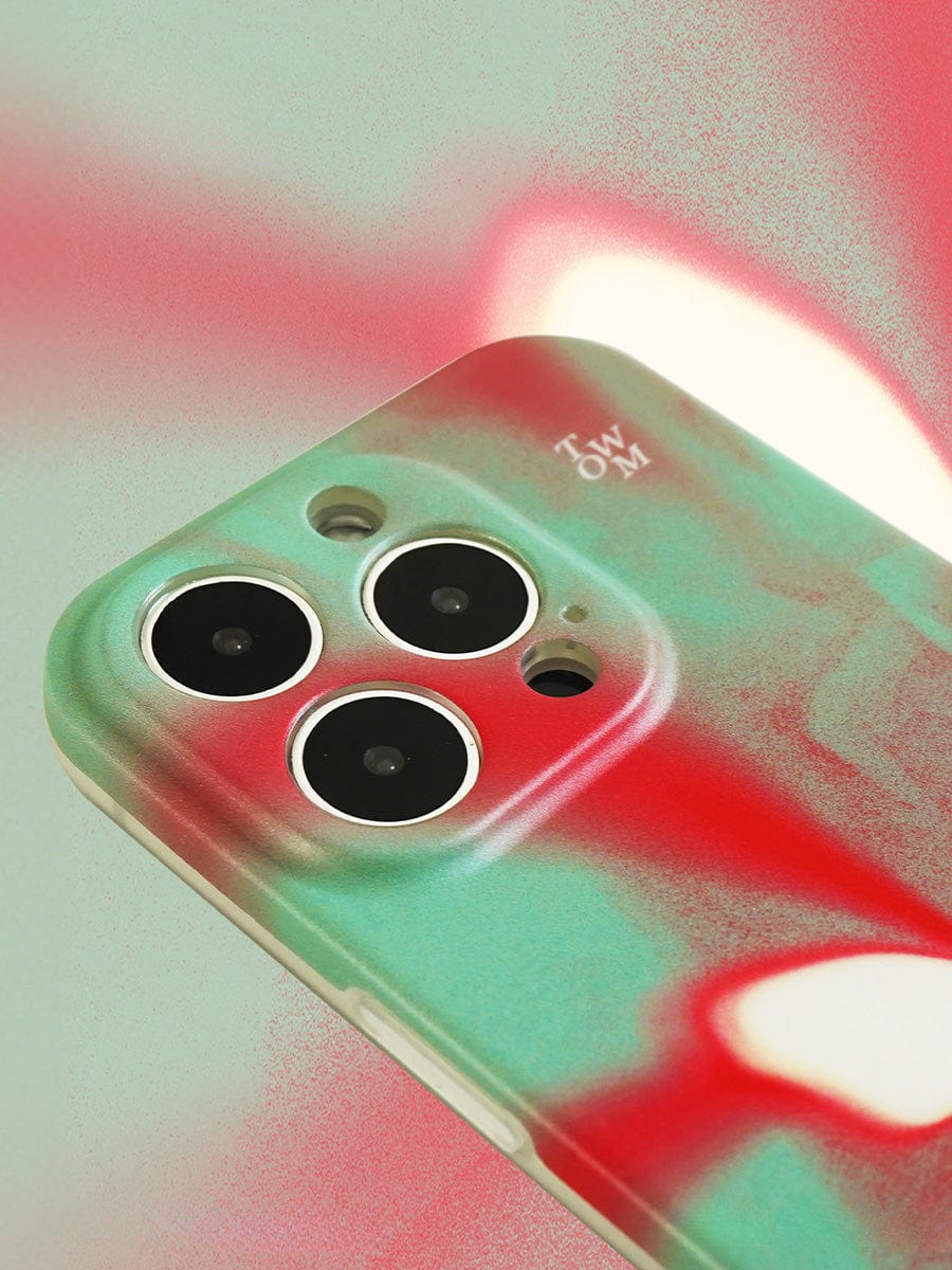 Close-up of the Butterfly Aura iPhone 16 Pro Max Case, showcasing its vivid green and red gradient design, with three camera lenses and a single flash.