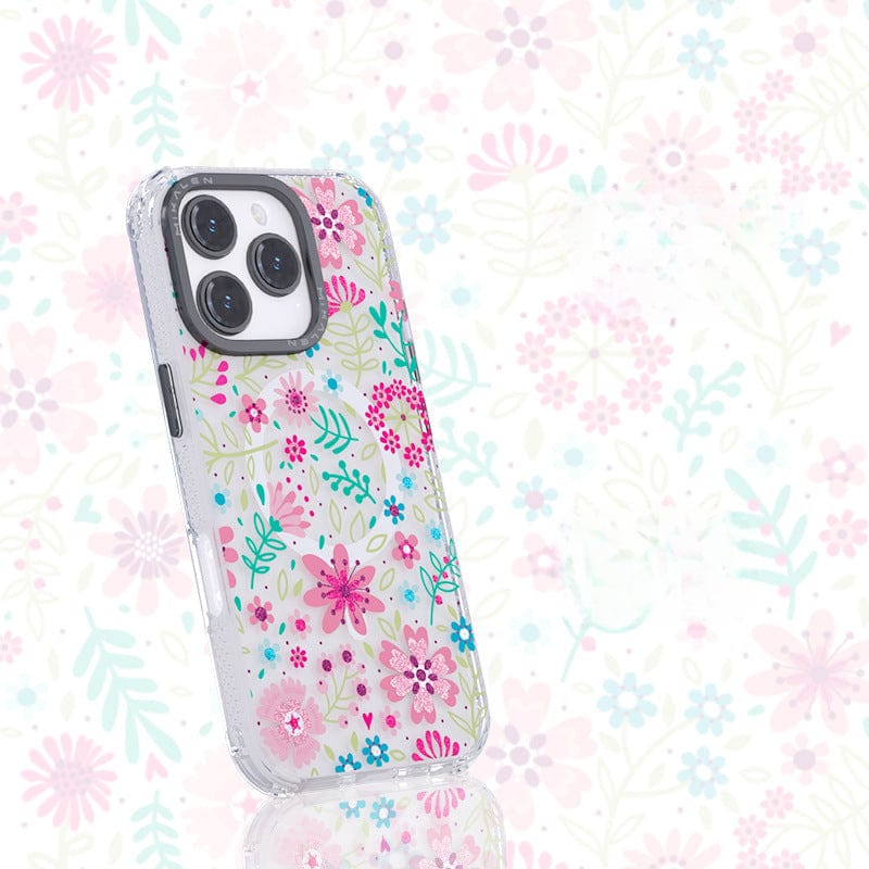 A Floral MagSafe iPhone 16 Pro Max Case with a shockproof clear cover and a vibrant 3D flower design is displayed against a matching floral background, perfectly showcasing the phone's three camera lenses.