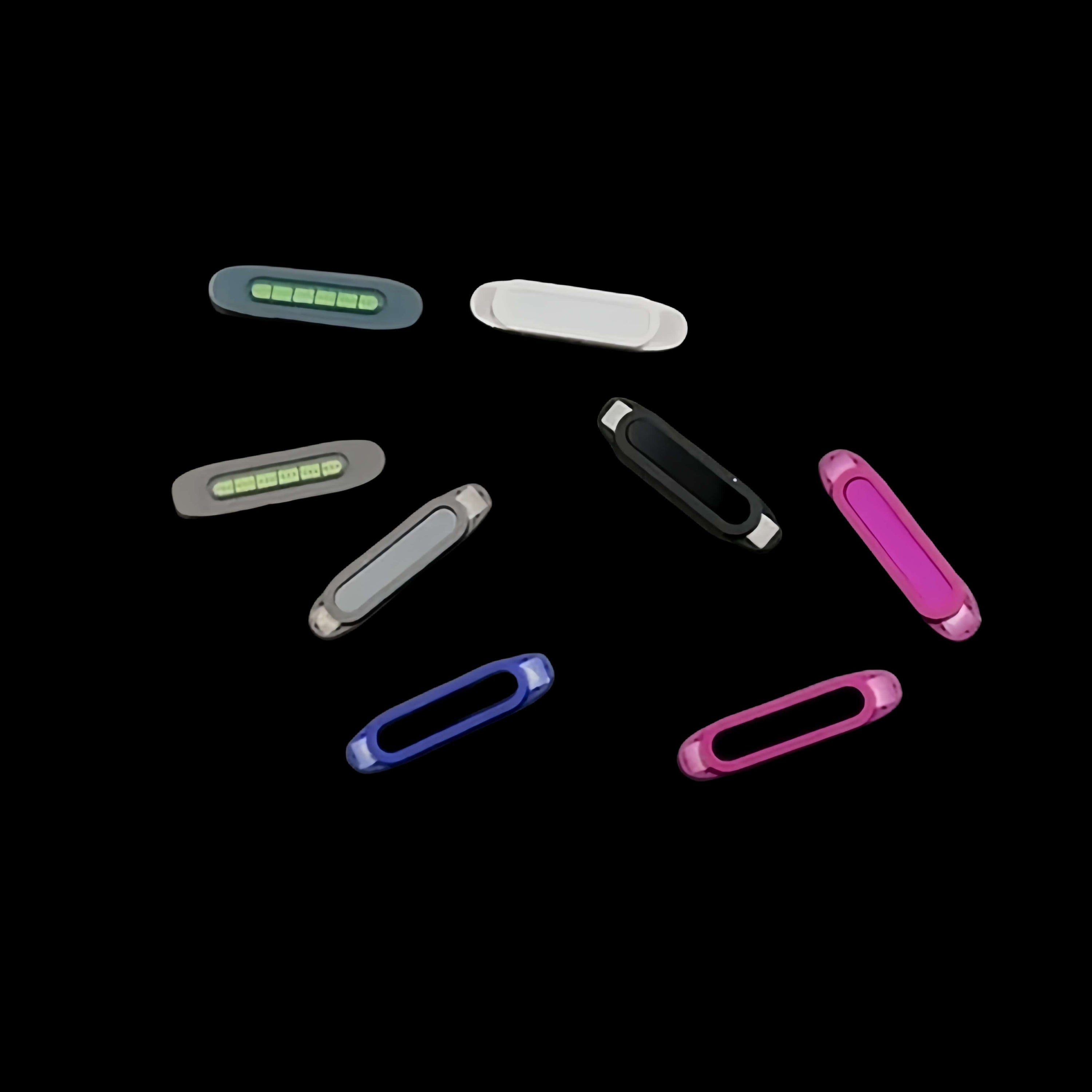 Eight colorful USB flash drives arranged on a black background, reminiscent of the vibrant display captured with the enhanced camera control of an iPhone 16 Pro Max using the Capture Button attachment.