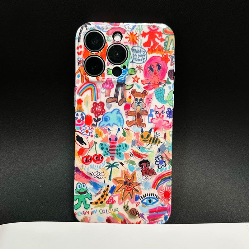 A smartphone with a Vibrant Doodle Art iPhone 16 Pro Max Case, covered in colorful hand-drawn designs featuring whimsical stars, hearts, animals, flowers, and abstract patterns, lies on a dark background. One visible text reads, "What’s on your mind?