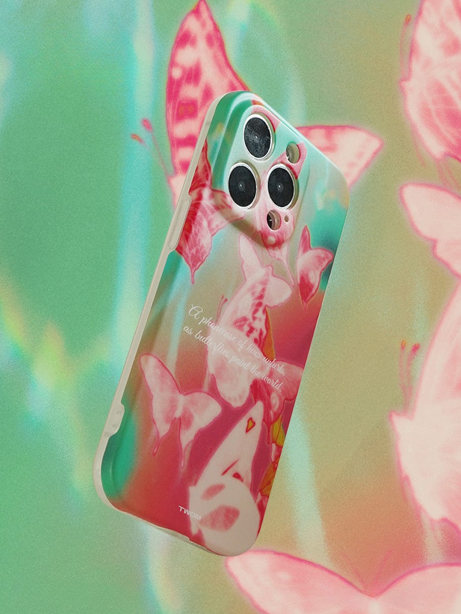 A smartphone encased in a Butterfly Dreamscape iPhone 16 Pro Max Case with a vivid multicolor design floats against a dreamy, pastel-colored background. The artistic cover showcases pink and white butterflies with a faint cursive caption, while the phone’s camera lenses are prominently visible.