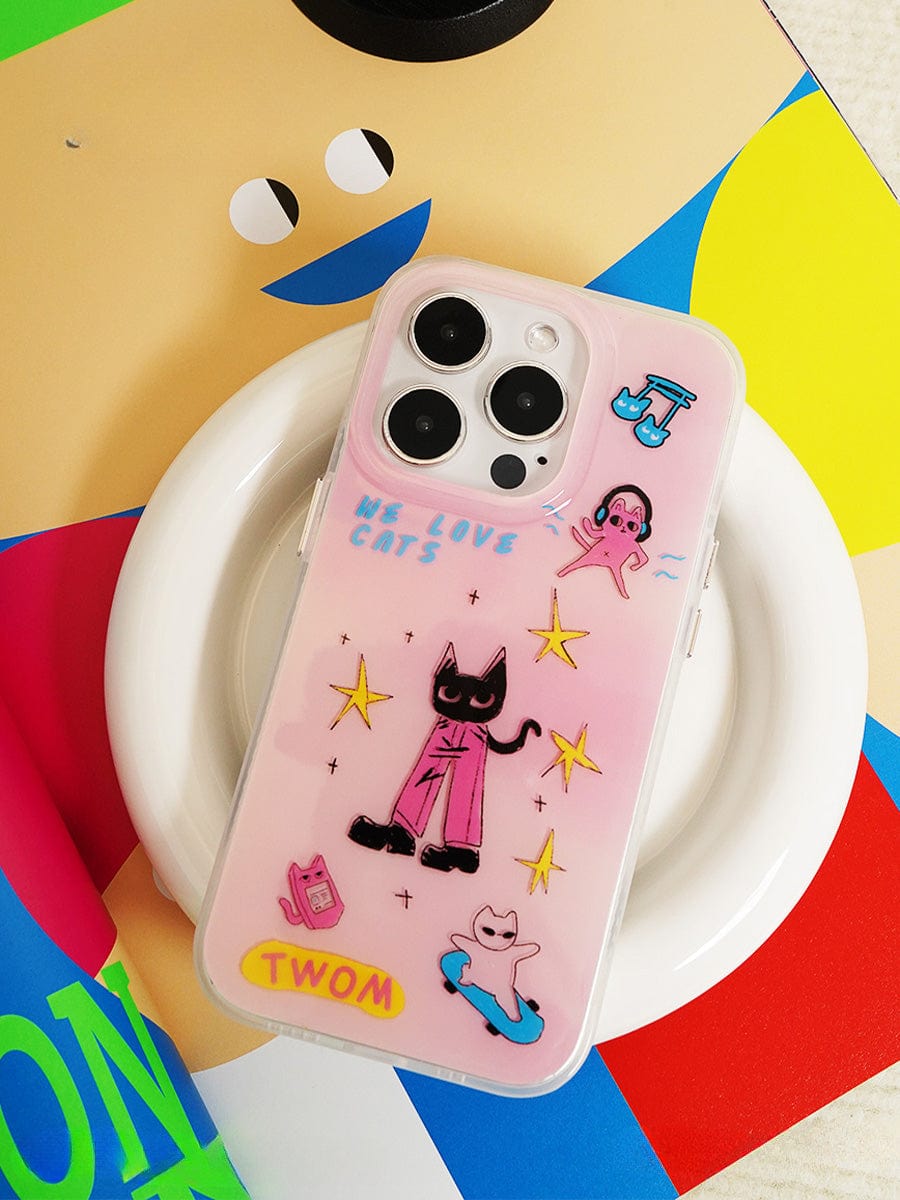 The We Love Cats iPhone 16 Pro Max Case, featuring a cute pink cartoon design with black and white cats in various poses and colorful stars, is displayed on the back of an iPhone. The phrase "WE LOVE CATS" is written in blue on the case. The phone is placed on a white circular dish with a colorful abstract background.